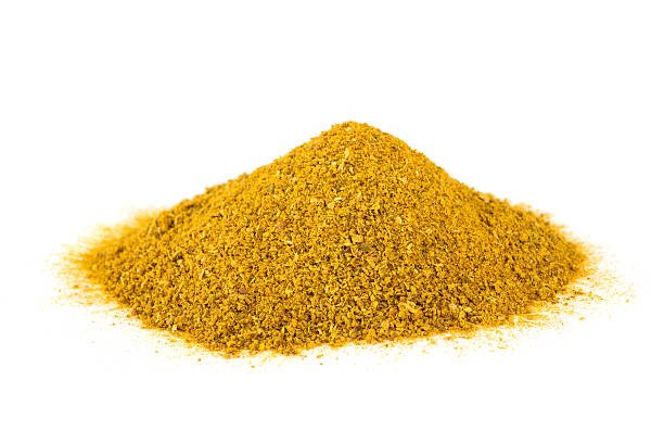 curry spice heap isolated on white background